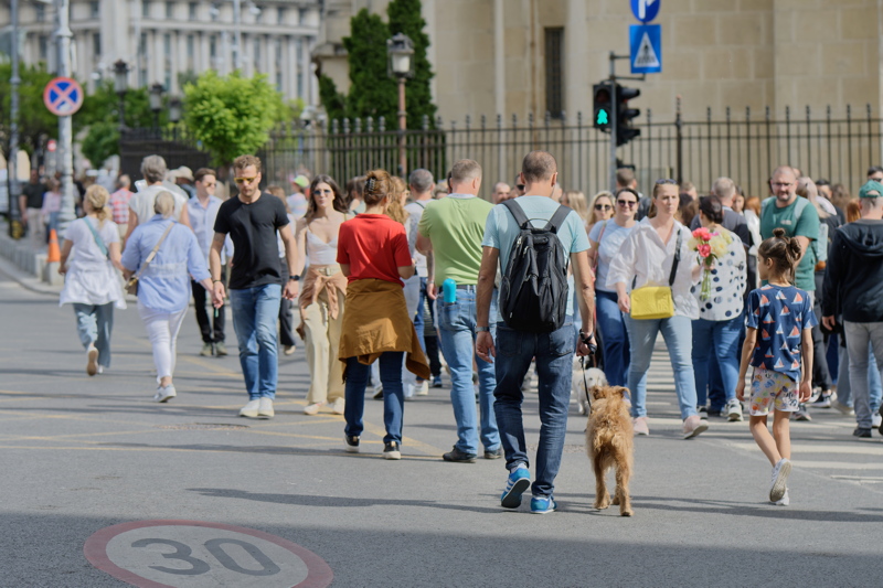 Tourists and locals strolling on Calea Victoriei in Bucharest, Romania